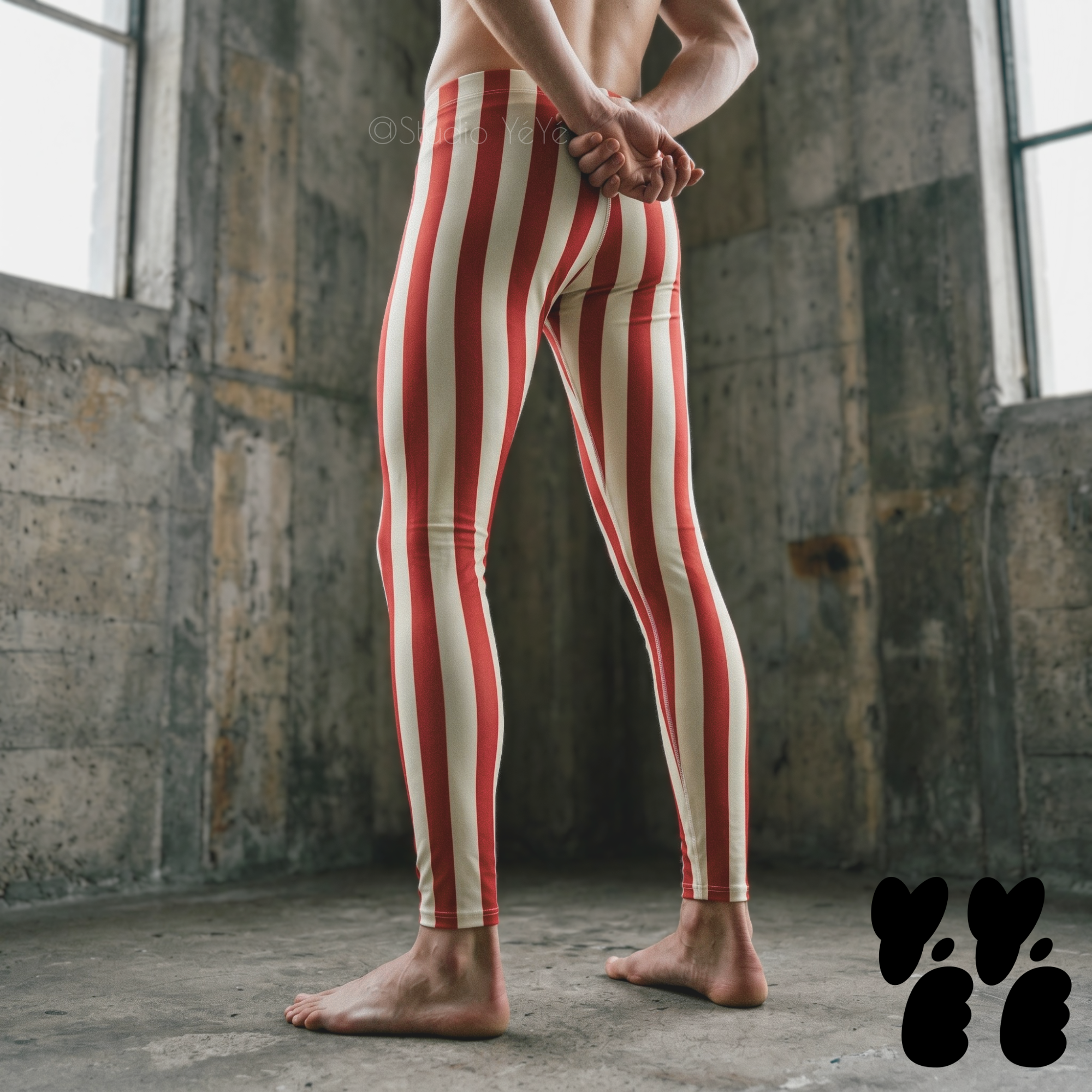 A male model wears bold red and white stripe leggings, circus core, clown core costume