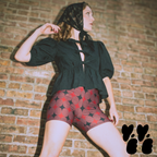 A vintage circus core style model wears mid century style diamond pattern bike shorts with puff sleeve tops