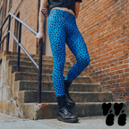 A hipster man wears cheetah printed mens leggings royal blue, with cropped t-shirts and combat boots.