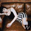A hipster woman wears black camisole with black and white striped bike shorts by studio yeye