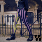 Model wearing purple, black, and acid green striped Circus Circus Halloween Mix leggings with black boots.