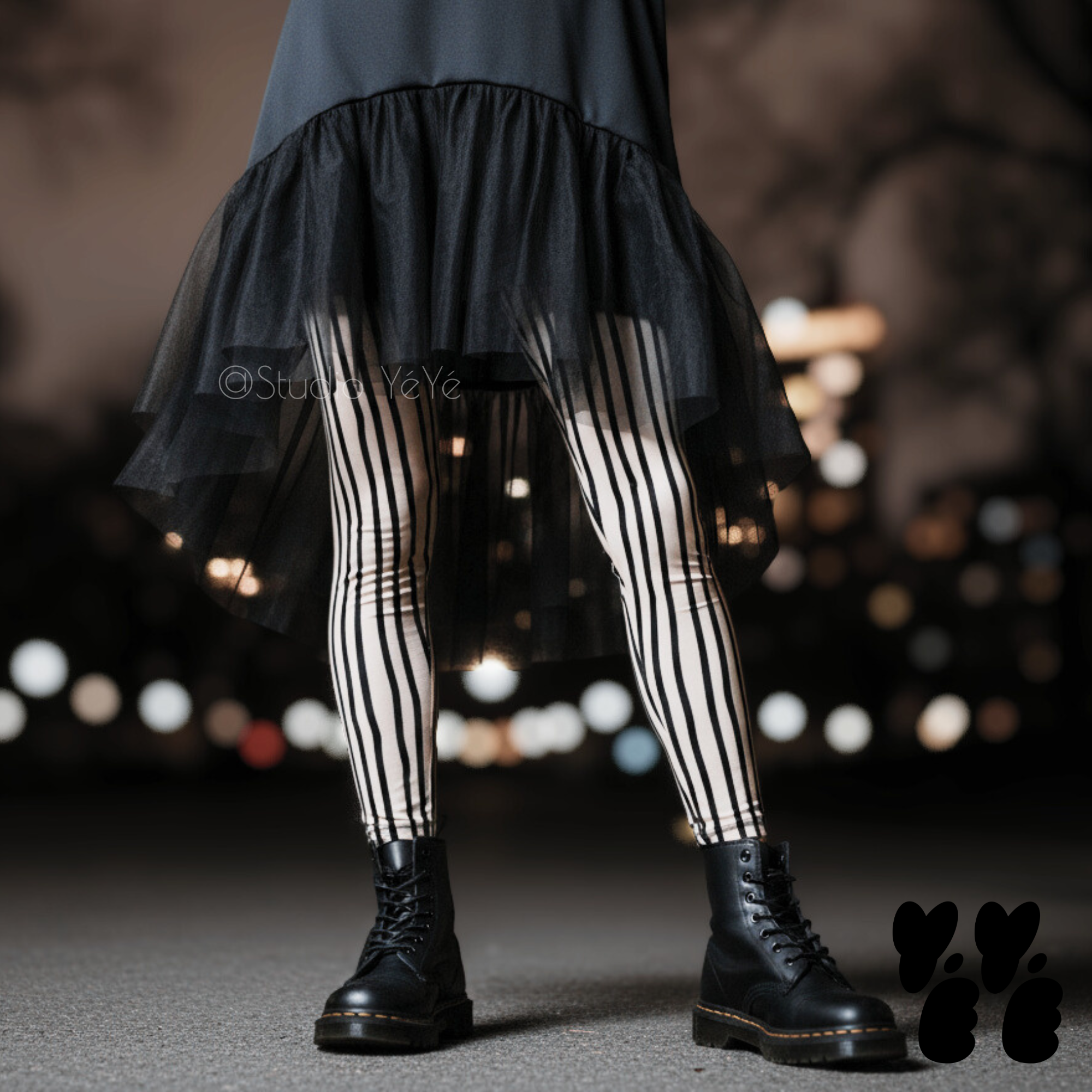 studio-yeye-doodle-stripe-leggings-cream-off white - a woman wearing the leggings with goth dress with dr marten boots