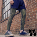 A male model wears running shorts, striped leggings in black and olive for men