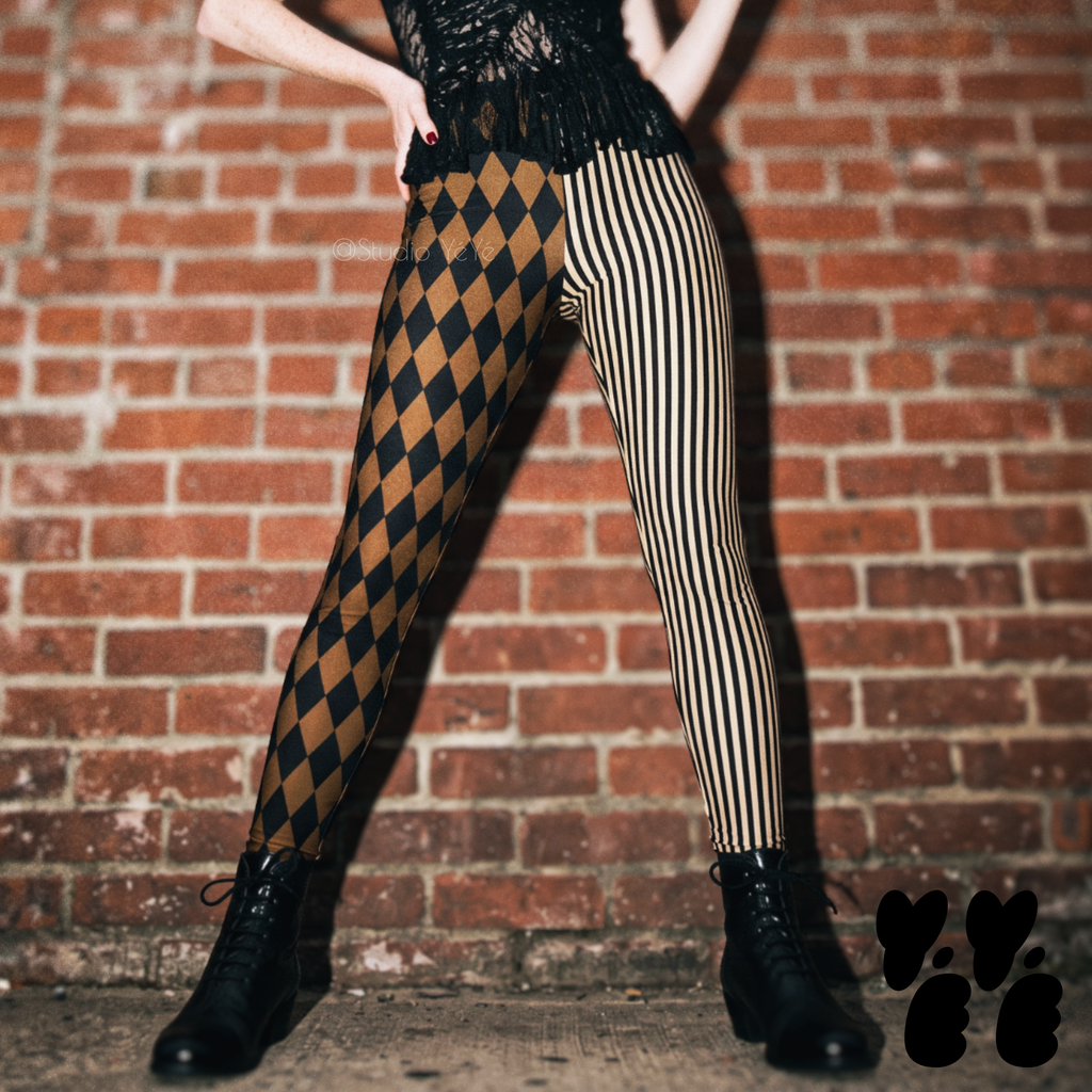 Model wearing brown and black harlequin diamond and fine pinstripe leggings with a dark lace top and black boots.