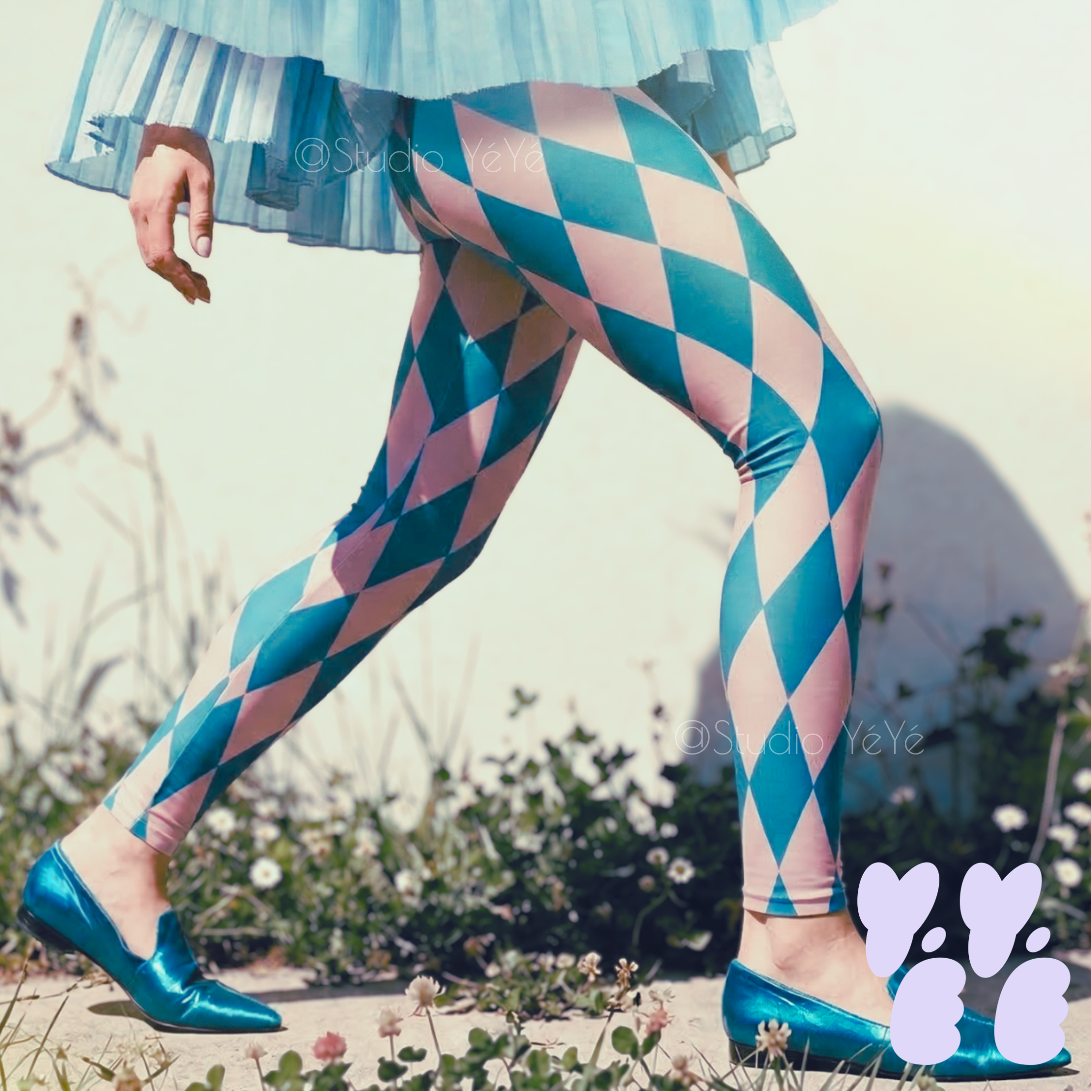 Pastel blue and pink harlequin diamond leggings by YéYé, styled with a blue pleated tutu skirt and metallic teal pointed flats