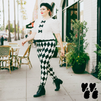 A plus size female model wears 2XL harlequin diamond leggings in black and white