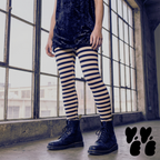 Black and white horizontal stripe leggings by YéYé, styled with a velvet tank top with dr marten boots