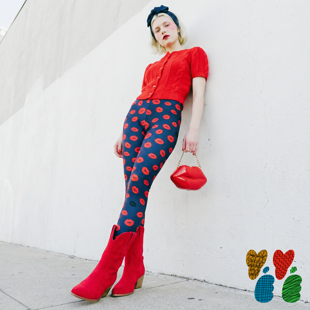 Navy blue leggings with repetitive red kiss mark pattern - Studio YéYé maximalist activewear.