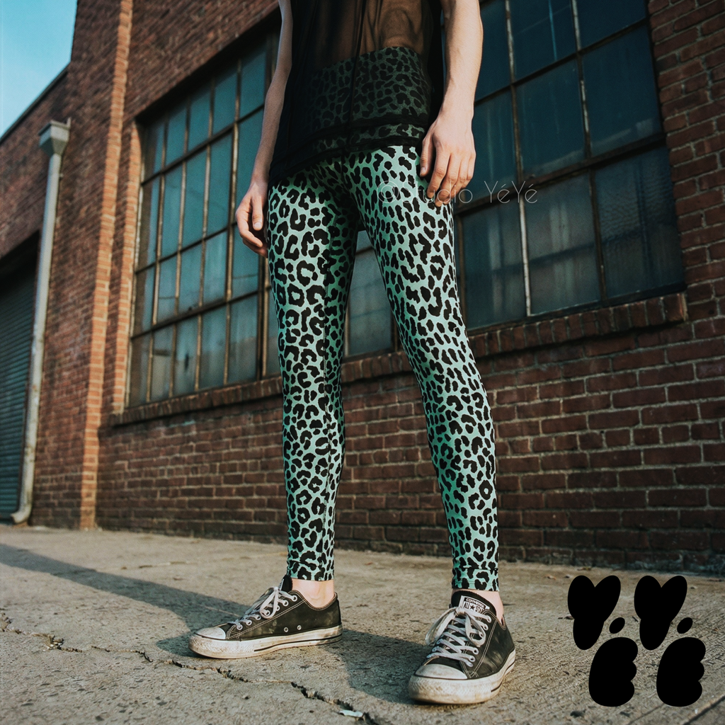 A genderless model wears leopard printed mens leggings in mint blue, with black converse shoes.
