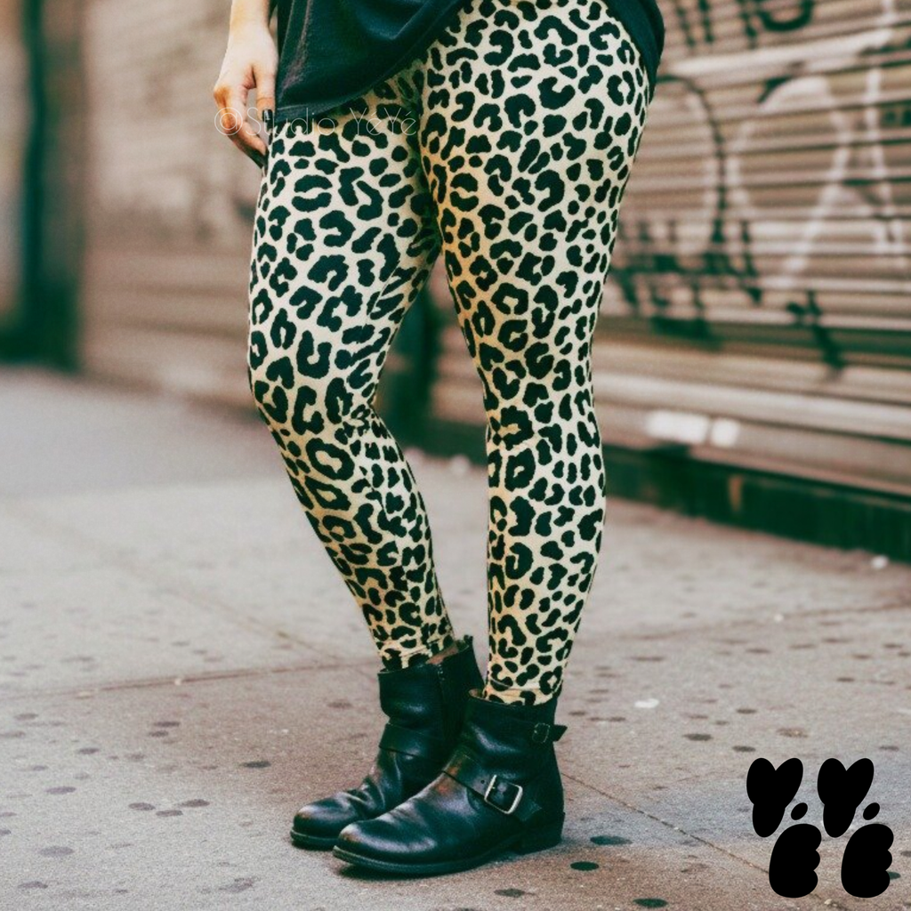 A plus sized female model wears 2XL leopard leggings in bone white