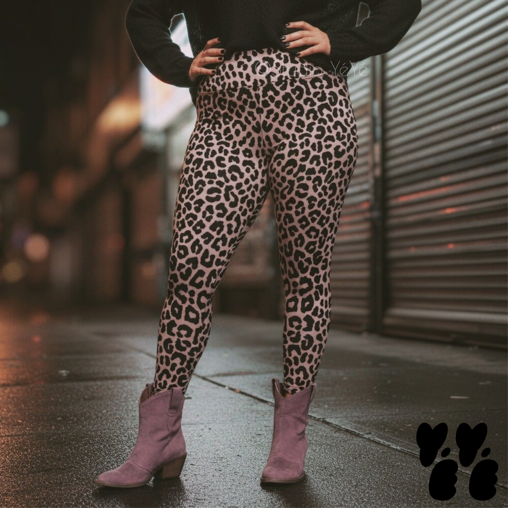 A plus sized female model wears 2XL leopard leggings in mauve pink