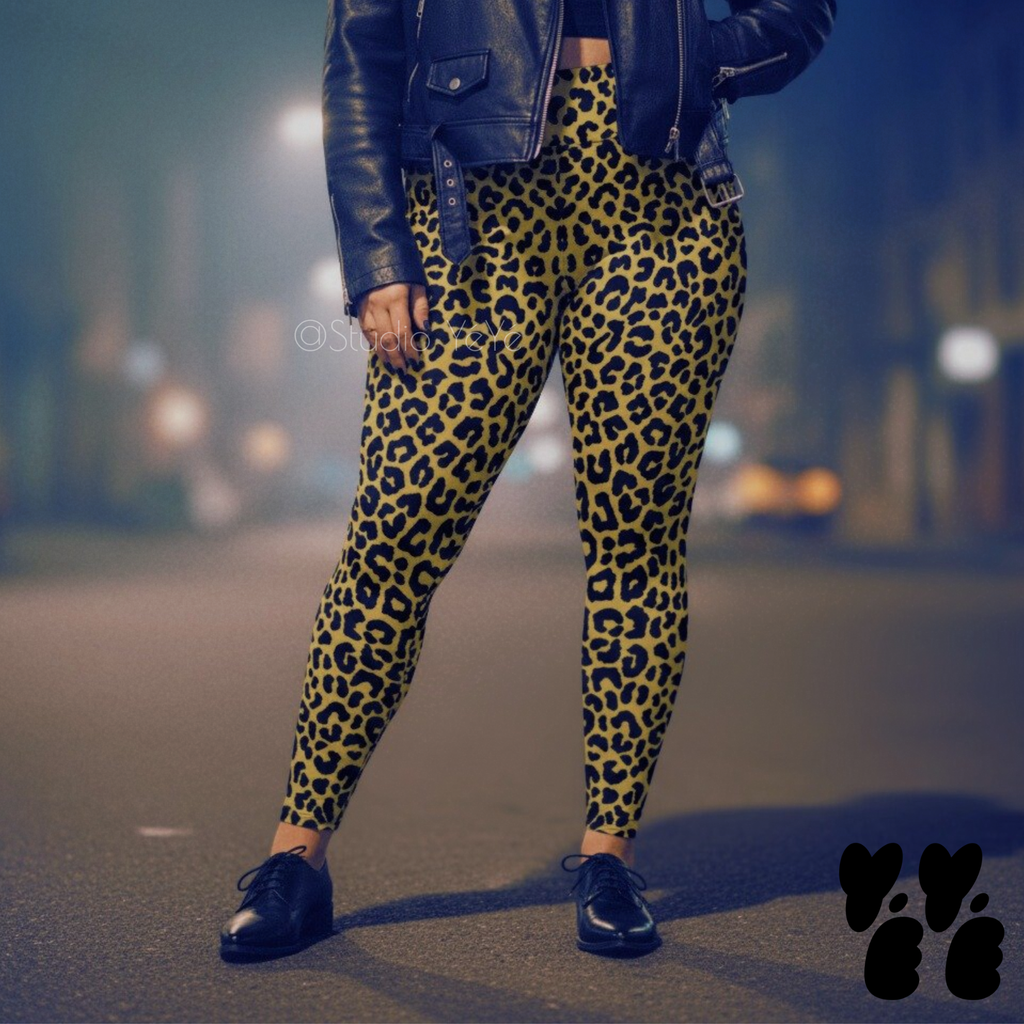 A plus sized female model wears 2XL leopard leggings in mustard