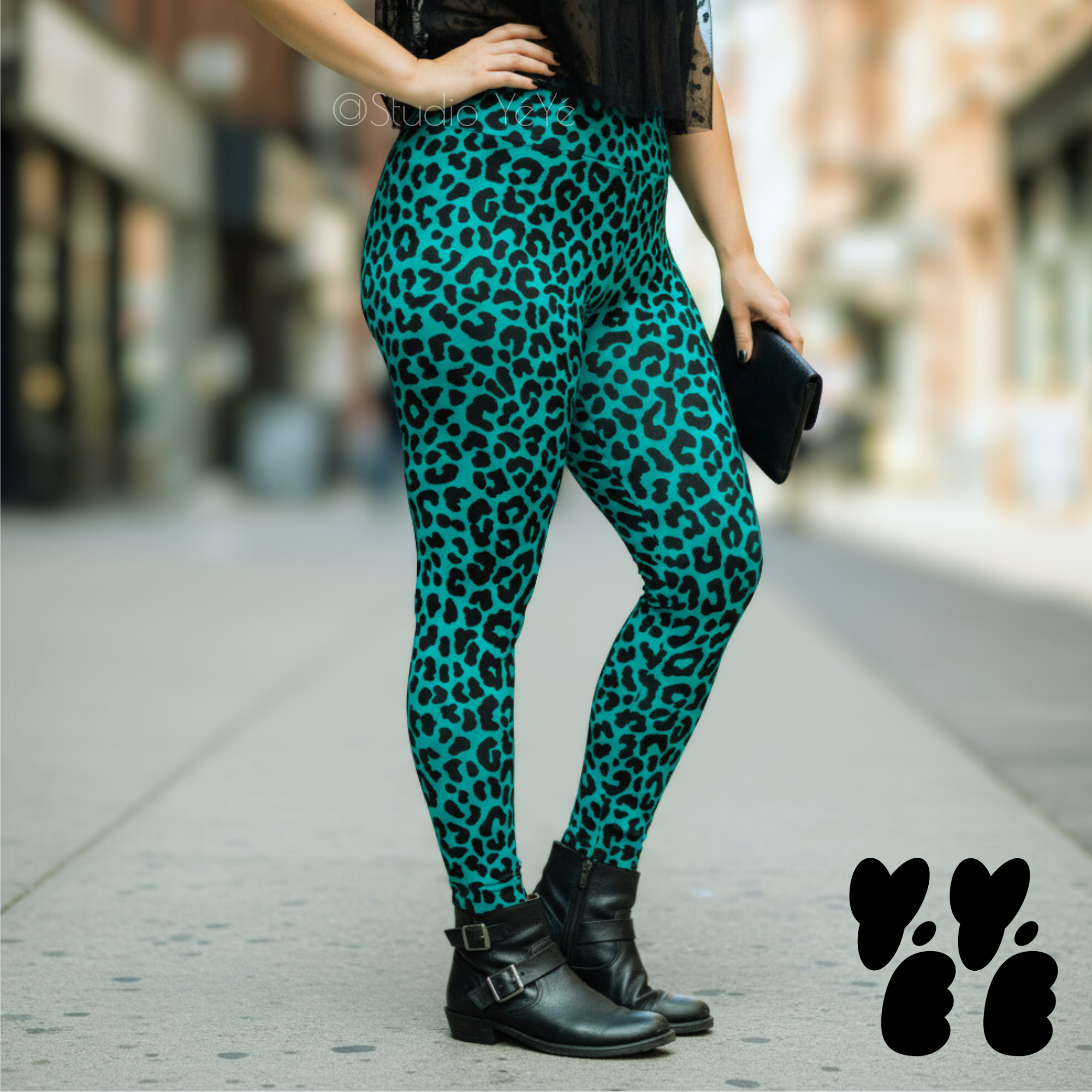 A plus sized female model wears 2XL leopard leggings in teal peacock blue 
