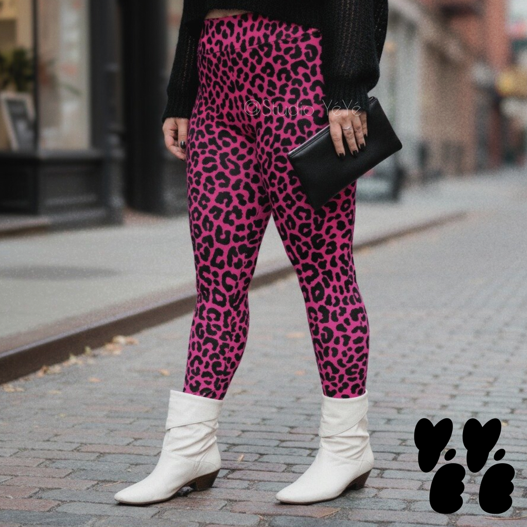 A plus size female model wears 2XL leopard print leggings in hot pink with vintage white boots.