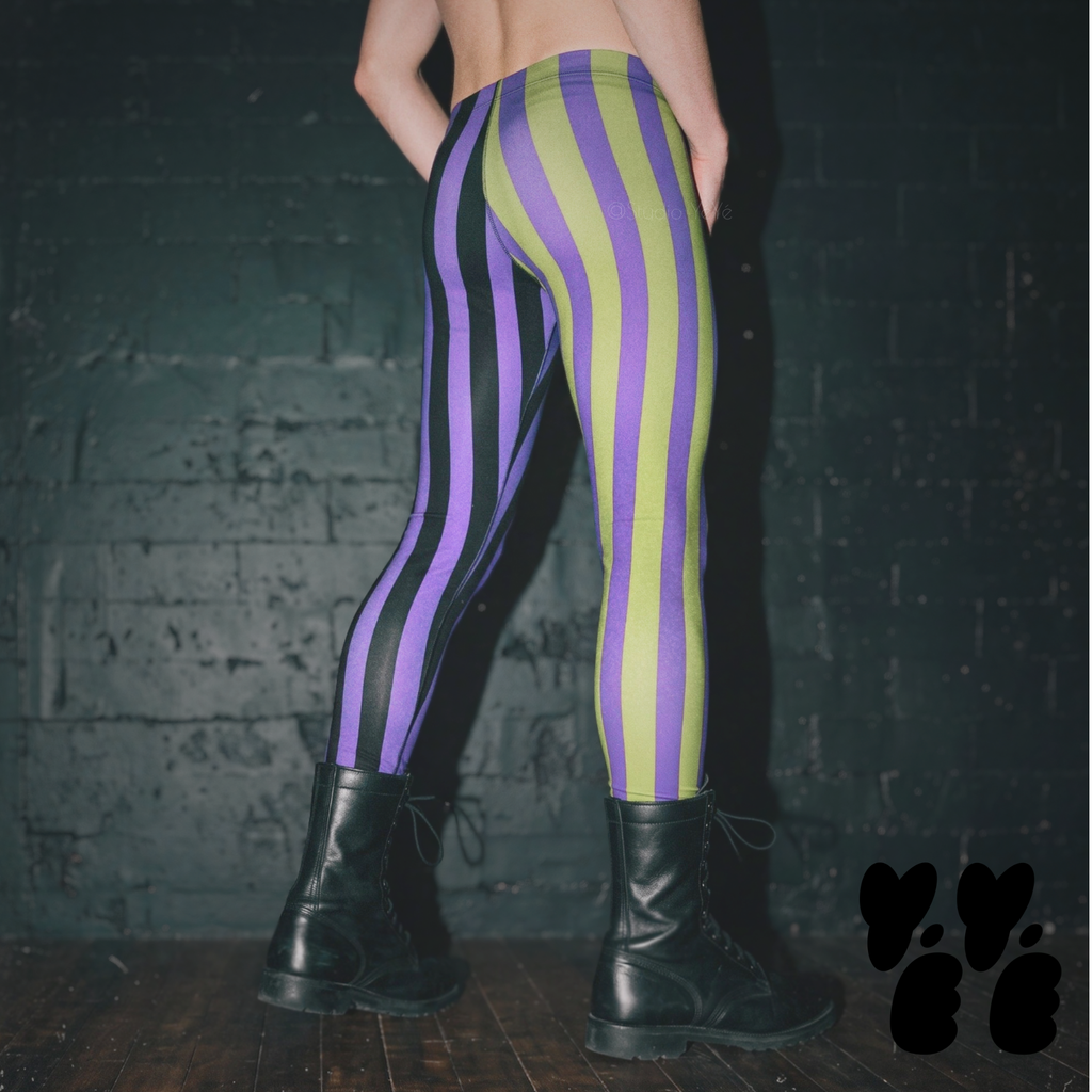A male model wears black, purple and acid green striped mens leggings, halloween clown vibe