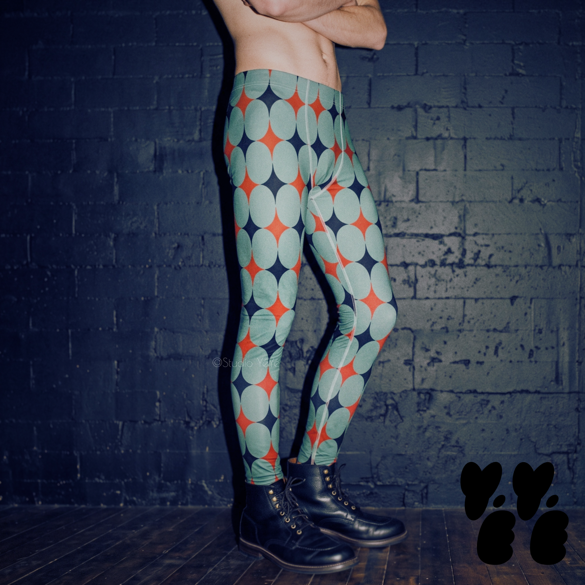A make model wearing mid-century las vegas style diamond pattern printed mens leggings.