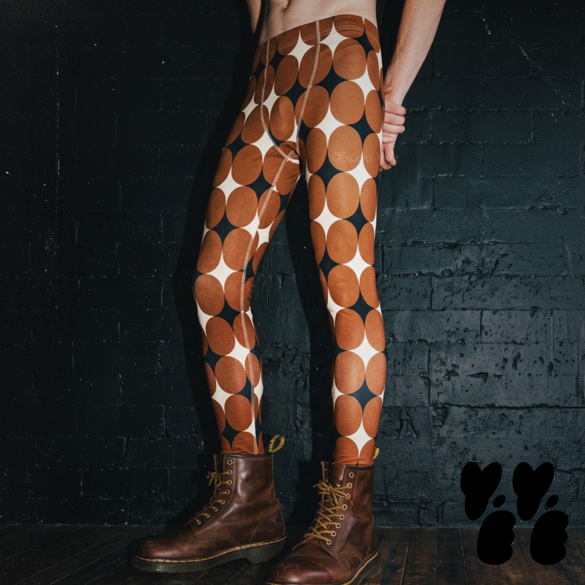 A male model wears mid-century style diamond print mens leggings