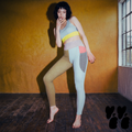 A japanese model wears asymmetrical colorful yoga leggings with deep pockets