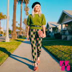 Dusty rose, olive green and black diamond check leggings with heart accents by YéYé, styled with a black pearl-embellished cable knit sweater, black velvet shorts and black lace-up ankle boots