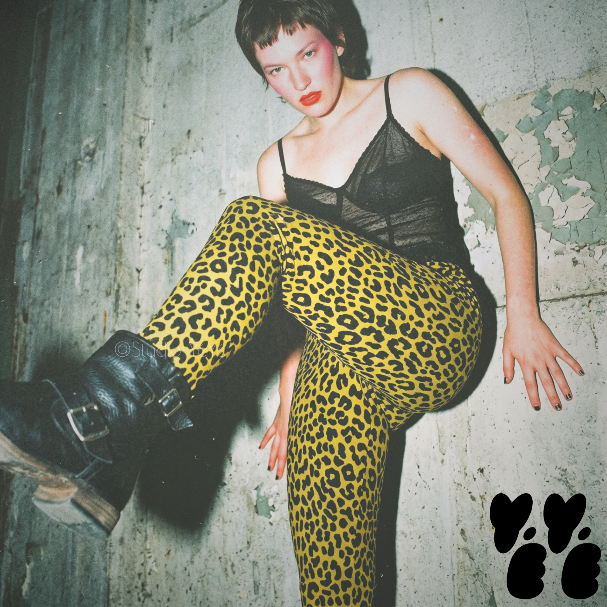 A punk woman wears mustard yellow leopard leggings from studio yeye