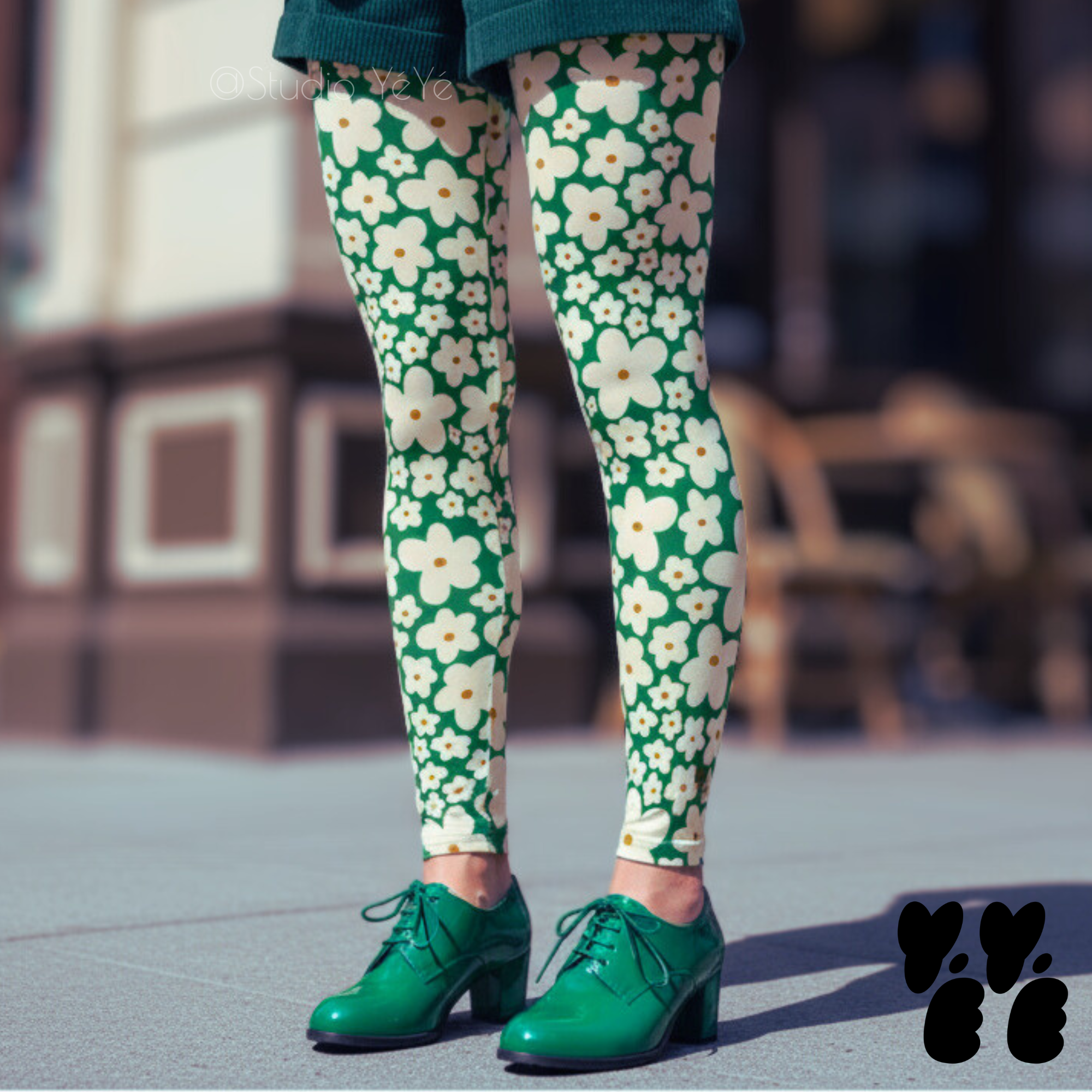 Kelly green and cream 60s retro floral print leggings by YéYé, styled with a green corduroy shorts, and vintage green shoes.
