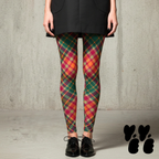 Oversized diagonal pink and green tartan leggings by YéYé, styled with a black sleeveless blazer dress and black brogue oxford shoes