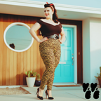 A rockabilly plus size female model wears 2XL tiger leggings in yellow mustard