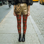 Retro red tartan plaid leggings by YéYé, styled with a black chiffon shirts, gold shorts, leopard bag with black patent leather studs boots at Soho in NYC.